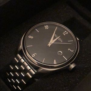 Silver and navy blue Nixon bullet watch